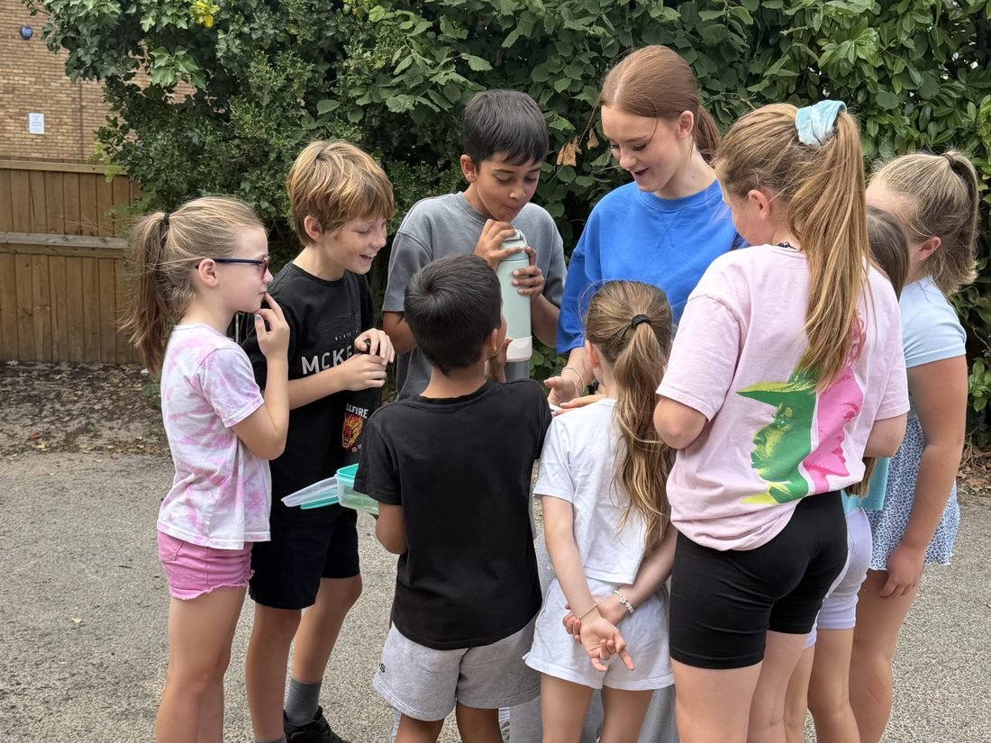 Kim Thursfield with a group of young performers outside